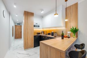 Kuchyň nebo kuchyňský kout v ubytování Apartament Perłowe Fale