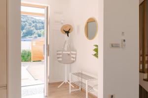 a dressing room with a mirror and a dresser at A'More Preko in Preko