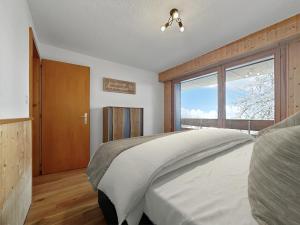 Postel nebo postele na pokoji v ubytování Ultimate Condo - 4 Valleys - Ski-in out - Swiss Alps