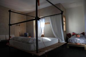 A bed or beds in a room at B&B acaso