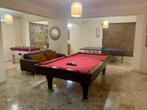 a living room with a pool table and two ping pong tables at Villa Ruya-PrivatePool-SeaView-GamesRoom in Fethiye