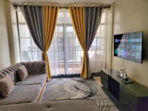 TV a/nebo společenská místnost v ubytování Cozy Apartment
