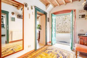 a large mirror in a living room with an open door at Antica Dimora Il Murrotto in Lanciole