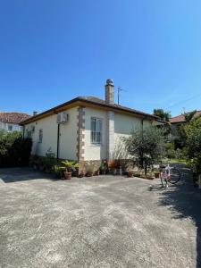 a house with a driveway in front of it at Shkodra Green Heart in Shkodër