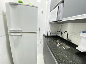 Η κουζίνα ή μικρή κουζίνα στο Kitnet bem localizada na Mallet