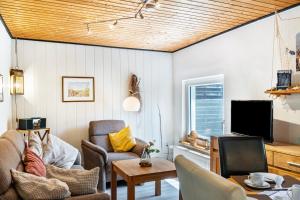 Μια τηλεόραση ή/και κέντρο ψυχαγωγίας στο Ferienhaus Strandfloh