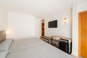 Postel nebo postele na pokoji v ubytování Hotel RH Sol