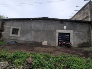 a motorcycle parked in front of a building at Residential House in Juigalpa