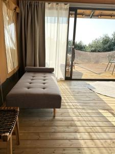 a room with a bed and a large window at Riza Eco Tents in San Vito lo Capo +34 photos