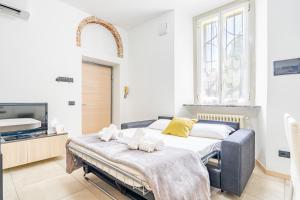 Postel nebo postele na pokoji v ubytování Cascina Fedeli - Stazione e Centro