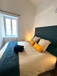 Ένα ή περισσότερα κρεβάτια σε δωμάτιο στο L' Arène Romaine