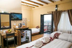 Ein Bett oder Betten in einem Zimmer der Unterkunft Hotel Tourist Residency