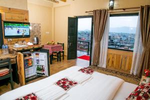 Ein Bett oder Betten in einem Zimmer der Unterkunft Hotel Tourist Residency