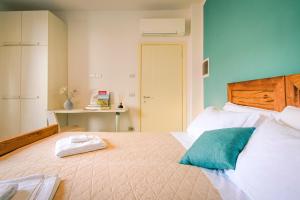 Posteľ alebo postele v izbe v ubytovaní La Rosa nel Borgo - Suite con balcone e garage