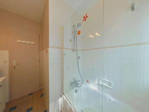 a bathroom with a shower with a glass door at Appartement au centre - 3 pièces, 6 personnes, ascenseur - FR-1-241-222 in Le Grand-Bornand +11 photos