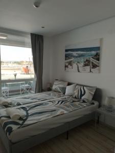 Postel nebo postele na pokoji v ubytování Paradiso Aparthotel, Studio 106