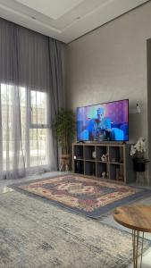 TV a/nebo společenská místnost v ubytování تريفانا شاليه trevana chalett