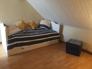a bedroom with a bed in a attic at Etape cocooning in Villefranche-Saint-Phal