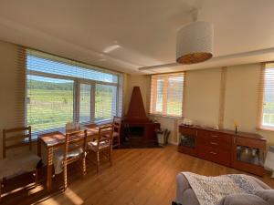 a living room with a table and a dining room at Vacational house, 25 km from UB in Ulaanbaatar +8 photos