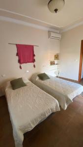Ένα ή περισσότερα κρεβάτια σε δωμάτιο στο Algarrobo Room, your corner of calm and magical views