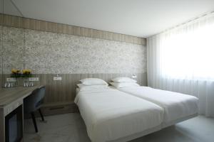 Hotel Capris Capodistria Boutique客房内的一张或多张床位