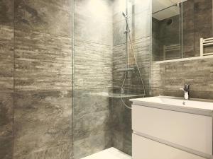 a bathroom with a shower and a sink at Spacious new studio and terrace in Juan-les-Pins +21 photos