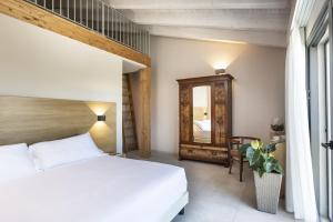 Postel nebo postele na pokoji v ubytování Ros'e Mari Green Home Hotel