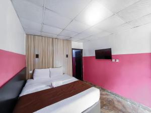 En eller flere senger på et rom på Ivy Hotel Awolowo