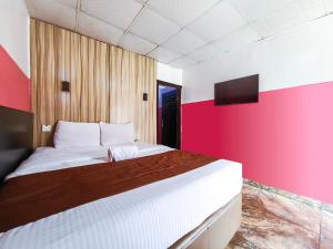 En eller flere senger på et rom på Ivy Hotel Awolowo