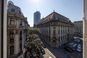 an aerial view of a city with buildings and cars at Old Town Apartment Lipscani in Bucharest
