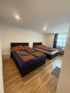 Letto o letti in una camera di Gasthaus Tisis