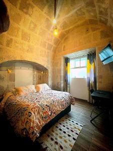 Cama o camas de una habitación en Bubamara San Lazaro