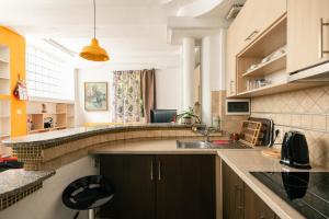 a kitchen with a sink and a counter top at Easy Stay Apartments in Pristina