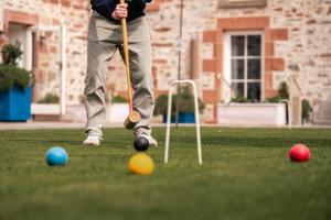 a man is playing with balls on the grass at Newhall Mains in Resolis +26 photos