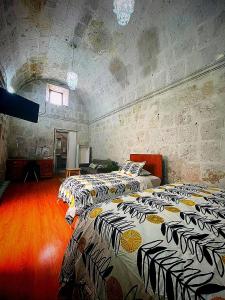 Cama o camas de una habitación en Bubamara San Lazaro