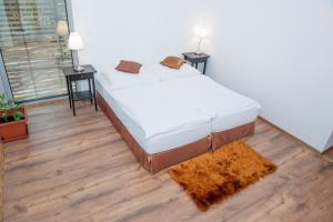 Llit o llits en una habitació de Villa Ľadoveň LUXUSNÝ APARTMÁN 124m2