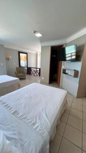 Łóżko lub łóżka w pokoju w obiekcie Flat Beira Mar em Recife