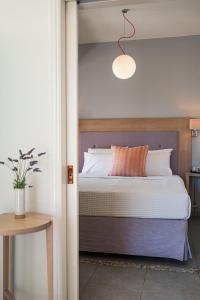 Ein Bett oder Betten in einem Zimmer der Unterkunft Ikion Eco Boutique Hotel
