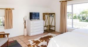 TV a/nebo společenská místnost v ubytování Sandriver Lodge