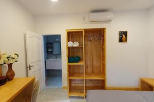 a living room with a kitchen with a sink at Stay Kora in Thinadhoo +44 photos