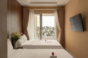 Μια τηλεόραση ή/και κέντρο ψυχαγωγίας στο Apartment Terra Royal, 280 Nam Kỳ Khởi Nghĩa, Quận 3, thành phố Hồ Chí Minh