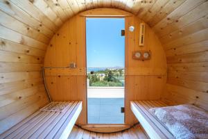 a room with a sauna with a window at Anelia Villa in Chania Town