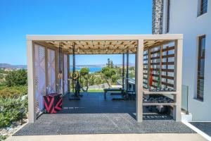 a gym with a view of the ocean from a building at Anelia Villa in Chania Town