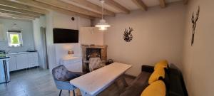 a living room with a couch and a table at La Merveille 795-848-628 in Solina