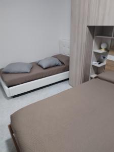 Postel nebo postele na pokoji v ubytování RIU b&b ALGHERO