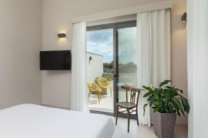 TV a/nebo společenská místnost v ubytování Ros'e Mari Green Home Hotel