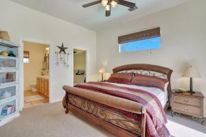 a bedroom with a large bed and a bathroom at Villa Escondida in La Quinta +16 photos