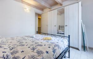 En eller flere senge i et værelse på GuestHost - La Ca' Rosa