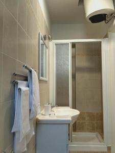 a bathroom with a sink and a shower at Tra S.Orsola e Fiera in Bologna