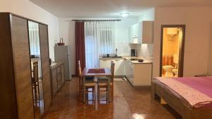 Postel nebo postele na pokoji v ubytování Apartman Mario